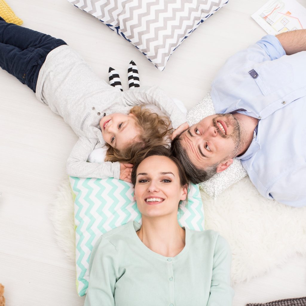 Happy family lying together
